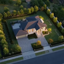 Professional-3D-site-plan-rendering-showing-a-modern-custom-home-from-an-oblique-aerial-view